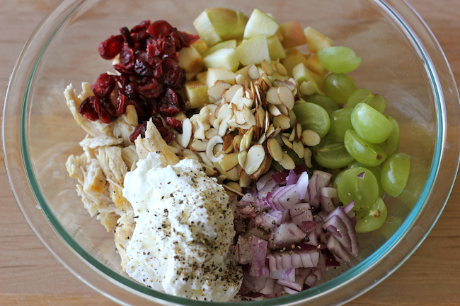 Greek Yogurt Chicken Salad Sandwich - From the plump grapes to the sweet cranberries, this lightened up sandwich won't even taste healthy!