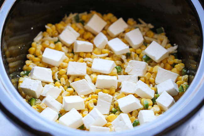 Slow Cooker Corn and Jalapeno Dip - Simply throw everything in the crockpot for the easiest, most creamiest dip ever!