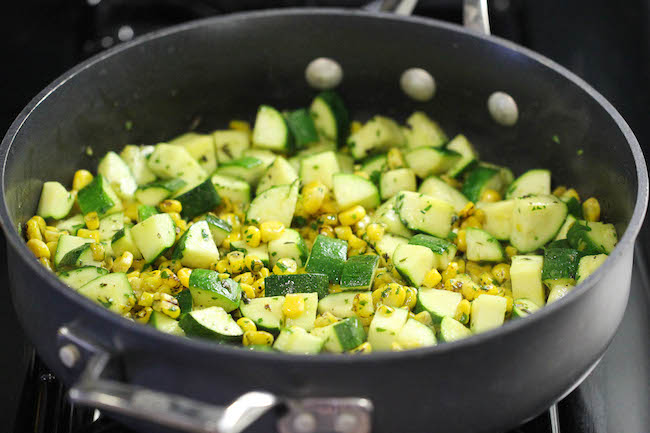 Parmesan Zucchini and Corn - A healthy 10 minute side dish to dress up any meal. It's so simple yet full of flavor!