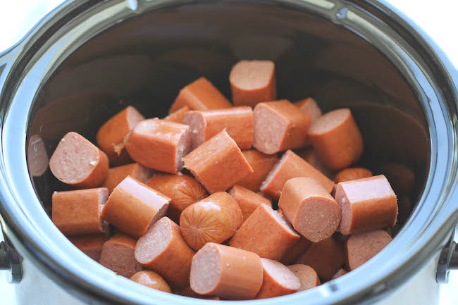 Slow Cooker Cocktail Sausages - The easiest sausages you will ever make in the crockpot. Just be sure to double the batch because these will disappear fast!