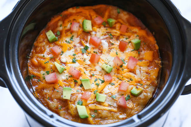 Slow Cooker Enchilada Stack - Simply turn on your crockpot and forget all about it until you have the cheesiest and creamiest enchiladas ever! It's so easy!