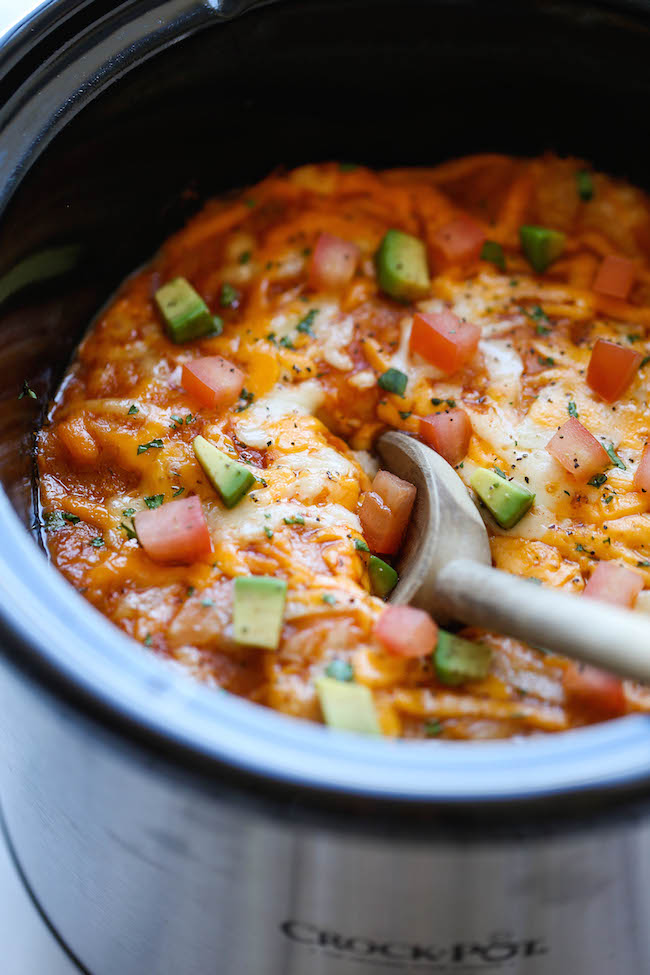 Slow Cooker Enchilada Stack - Simply turn on your crockpot and forget all about it until you have the cheesiest and creamiest enchiladas ever! It's so easy!