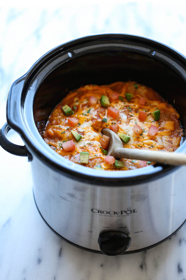 Slow Cooker Enchilada Stack - Simply turn on your crockpot and forget all about it until you have the cheesiest and creamiest enchiladas ever! It's so easy!