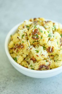 Roasted Garlic Cauliflower - A super simple and fast side dish to accompany any meal. Even the pickiest of eaters will be begging for seconds and thirds!