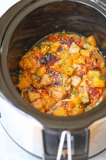 Slow Cooker Pineapple Chicken - Sweet, tangy chicken made right in your crockpot! And the pineapples are so juicy and flavorful with all that slow cooking!