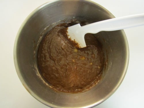 Chocolate banana muffin batter in a mixing bowl.