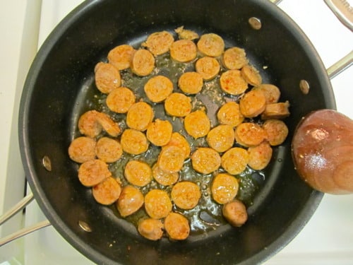 sweet potato and spicy sausage soup - sauted sausage in in a heavy medium saucepan