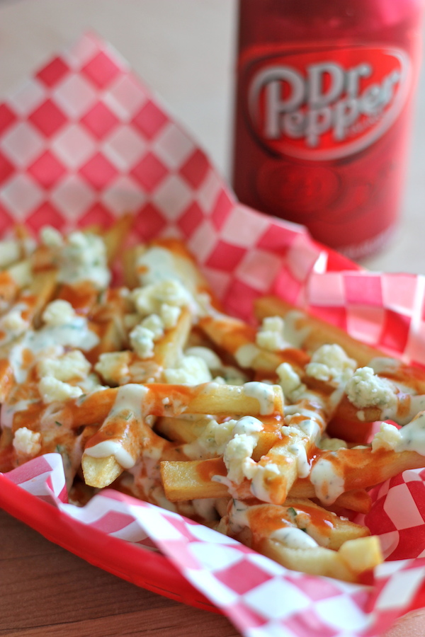 Buffalo Ranch Fries - Homemade french fries made to crisp perfection, topped with homemade Ranch dressing and buffalo sauce!