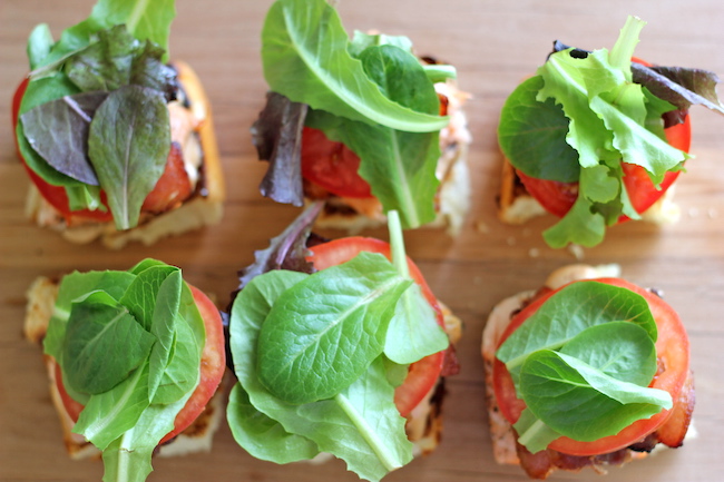 Salmon BLT Sliders with Chipotle Mayo - Loaded sliders with baked salmon and crisp bacon smothered in chipotle mayo.