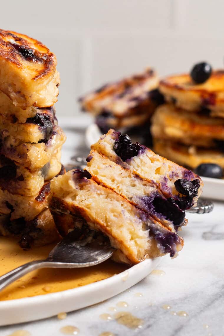 Blueberry Oatmeal Yogurt Pancakes - Start your mornings off right with these light, fluffy protein-packed pancakes, loaded with juicy blueberries. And they are freezer-friendly!
