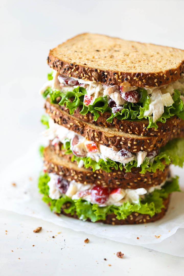Greek Yogurt Chicken Salad Sandwich - From the plump grapes to the sweet cranberries, this lightened up sandwich won't even taste healthy! PROMISE!