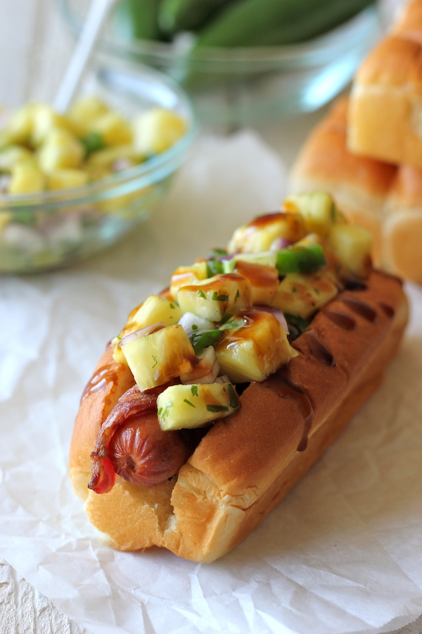 Bacon Wrapped Teriyaki Hot Dogs with Pineapple Salsa - A combination of crisp bacon, a refreshing salsa and a sweet teriyaki drizzle!