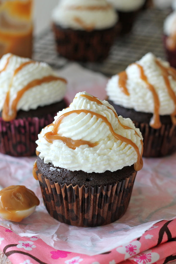 Pumpkin Mocha Cupcakes - These indulgent cupcakes are topped with whipped cream frosting and homemade dulce de leche made in the crockpot!