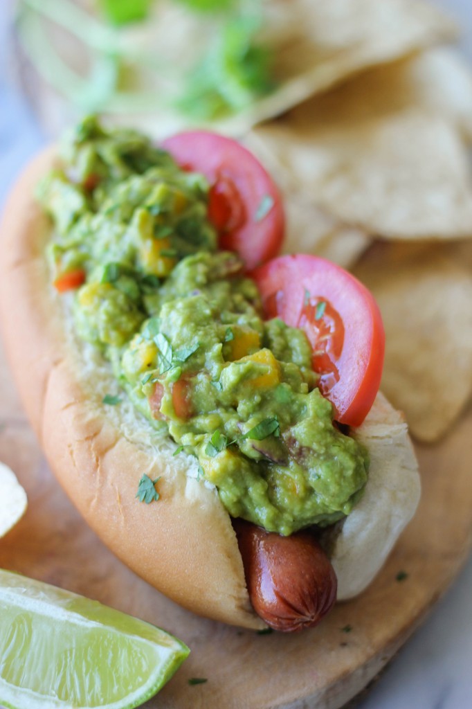 Sriracha Guacamole Hot Dogs - These hot dogs are so easy to make yet such a crowd-pleaser for everyone!