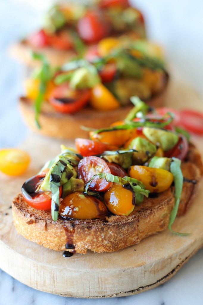 Avocado Bruschetta with Balsamic Reduction - With ripe avocado and juicy grape tomatoes, this is the perfect midday treat or party snack!