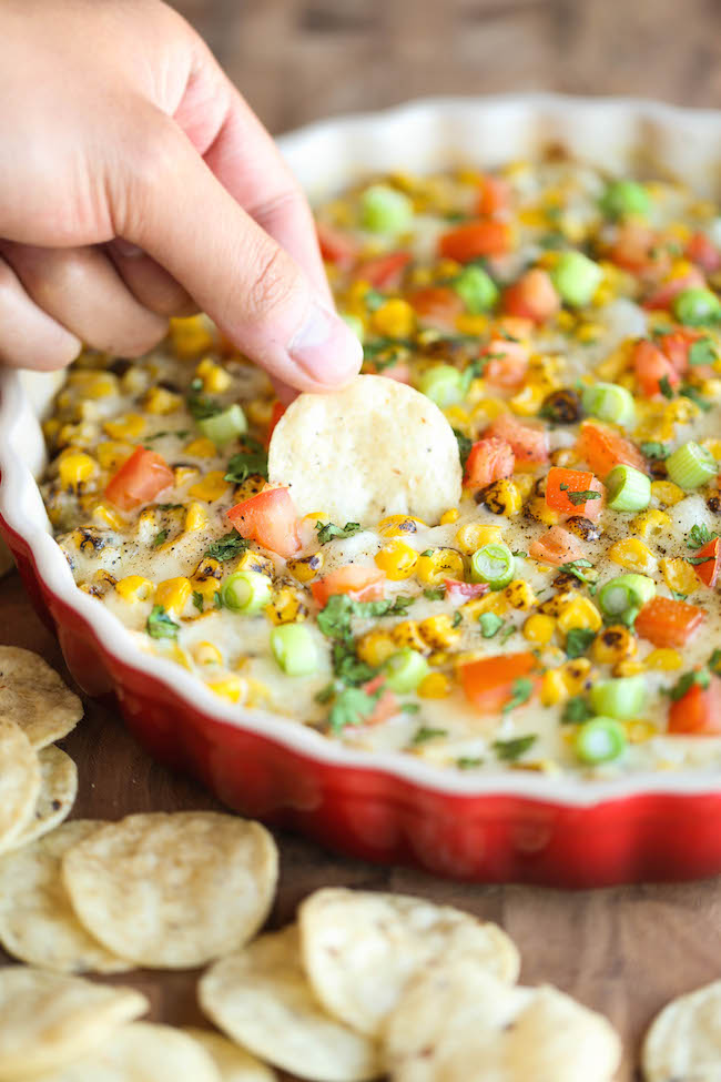 Hot Cheesy Corn Dip - A super easy and amazingly creamy corn dip that comes together with just 10 min prep. And it's even made "skinny" with Greek yogurt!