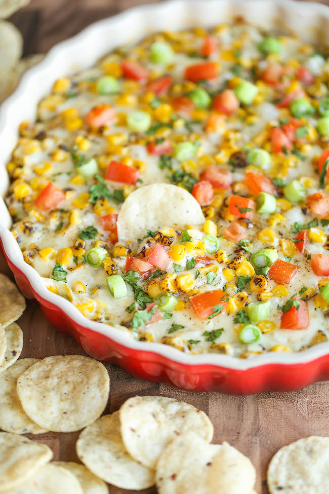 Hot Cheesy Corn Dip - A super easy and amazingly creamy corn dip that comes together with just 10 min prep. And it's even made "skinny" with Greek yogurt!