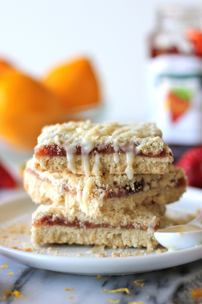 Strawberry Crumb Bars with Meyer Lemon Glaze - These bars are loaded with strawberry jam and topped with a tangy glaze!