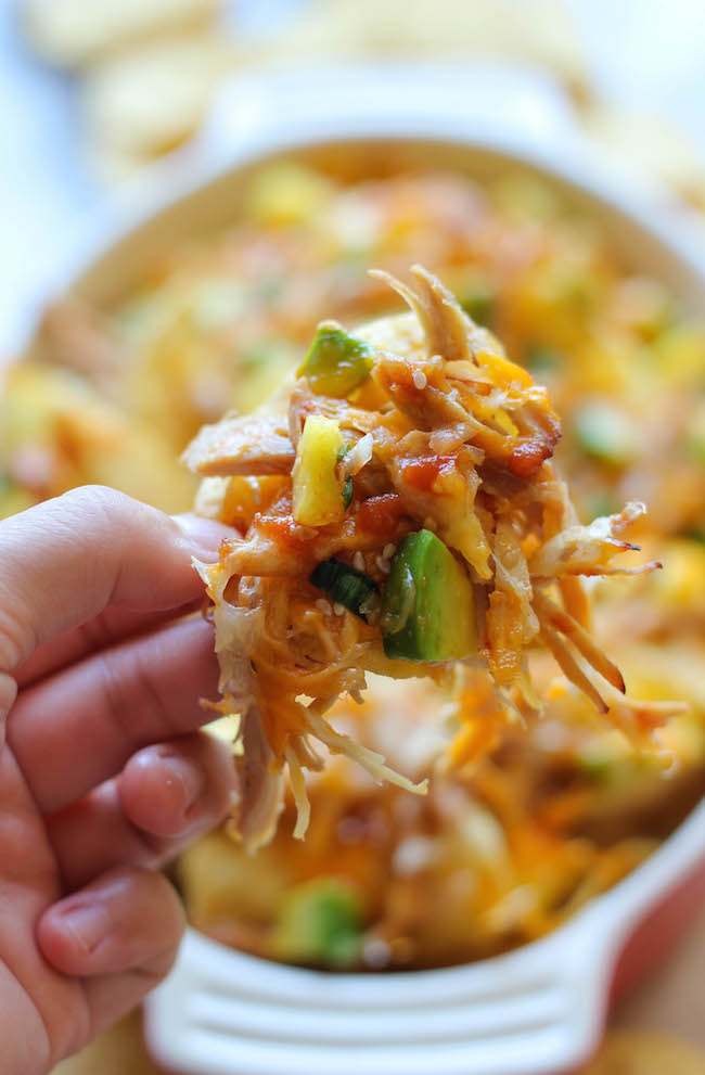 Asian Style Nachos - Loaded with leftover chicken teriyaki, fresh pineapple and spicy Sriracha, the whole family will be begging for more!
