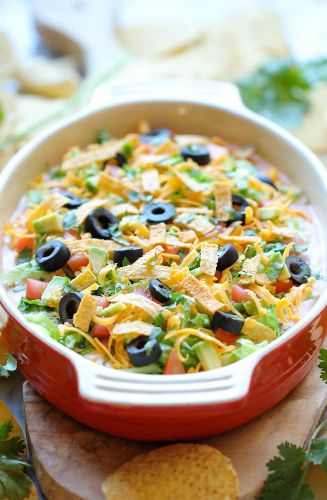 Skinny Taco Dip - Skip the guilt in this lightened up, super easy, 10-min taco dip. Perfect as a party appetizer for game day!