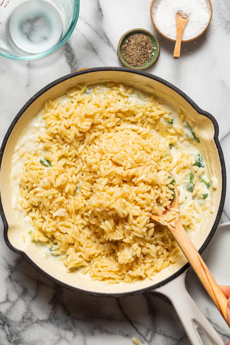 Parmesan and Spinach Orzo - This creamy, velvety orzo side dish is quick and easy + will go with any main dish! An absolute family-favorite.