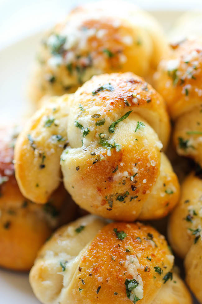 Easy Garlic Parmesan Knots - Fool-proof, buttery garlic knots that come together in less than 20 min - it doesn't get easier than that!