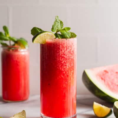 Fresh watermelon slush garnished with lime and mint