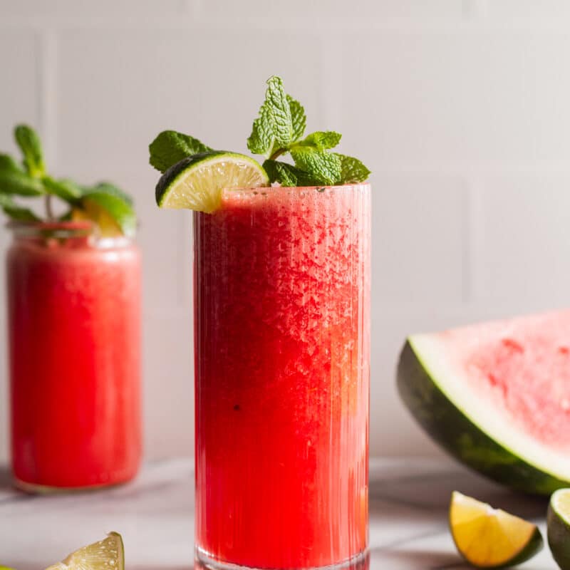 Fresh watermelon slush garnished with lime and mint