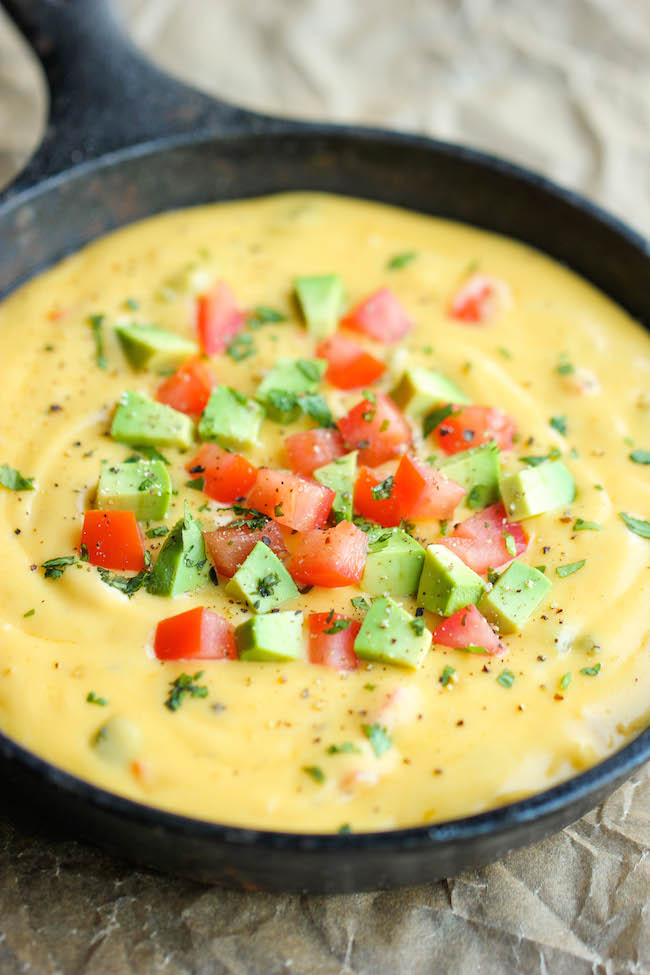Skinny Queso Dip - An amazingly cheesy and creamy dip that you can enjoy guilt-free. It's so good, you'll want to eat this with a spoon!