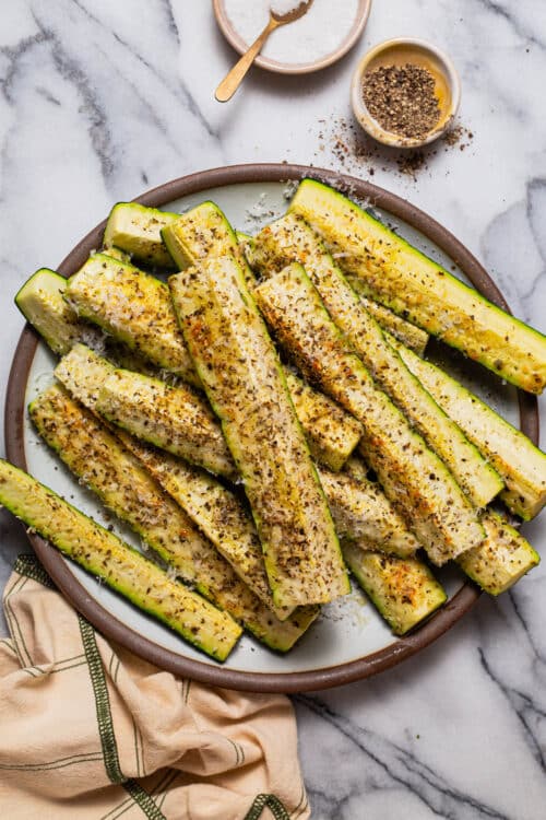 Roasted Parmesan zucchini sticks with herbs and seasoning
