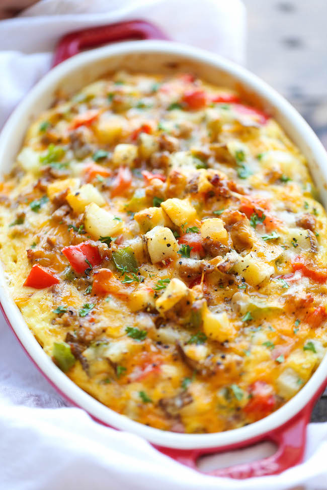 Cheesy Breakfast Casserole - The best and easiest make-ahead breakfast casserole loaded with sausage, potatoes and cheesy goodness!