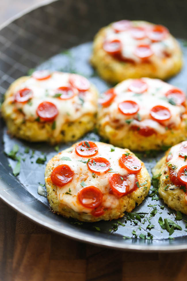 Mini Cauliflower Pizzas - These pizzas are made into easy single-serving portions and are so much healthier with a crisp cauliflower crust! 98.5 calories.
