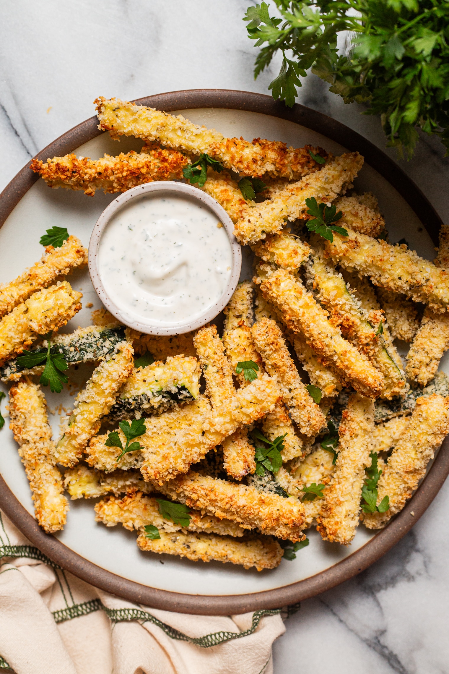 Golden baked zucchini fries with crispy parmesan coating