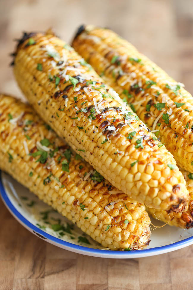 Parmesan Corn on the Cob - So buttery, garlicky and loaded with Parmesan cheese goodness - grilled (or roasted) to absolute perfection! 