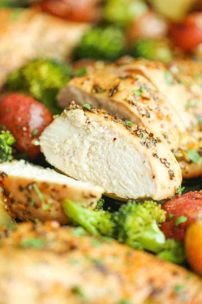 One Pan Honey Garlic Chicken and Veggies - Tender, juicy chicken breasts baked to perfection with potatoes and broccoli. All cooked on a single pan! EASY!