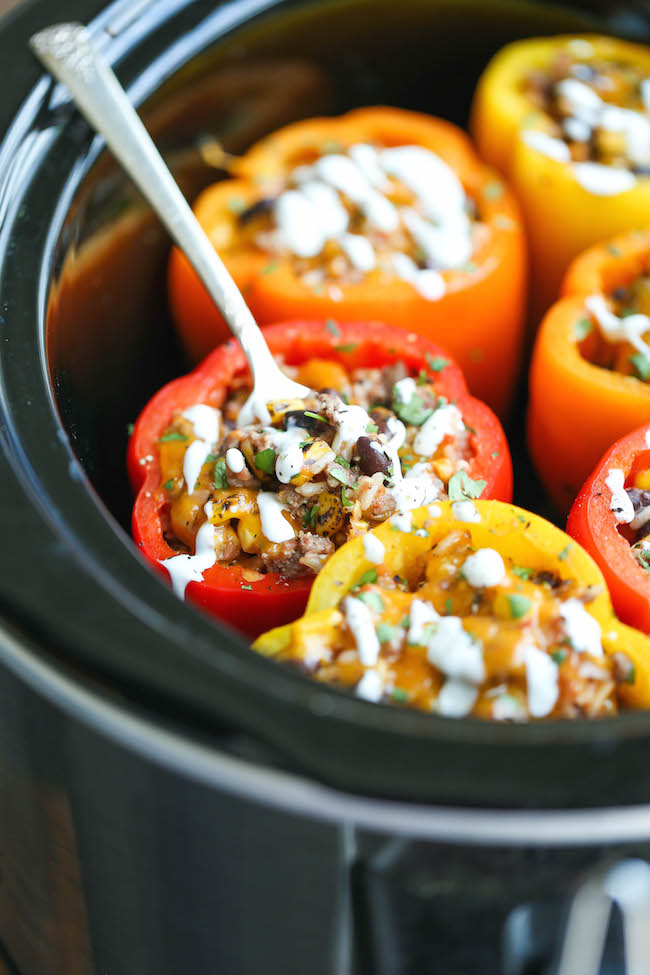 Slow Cooker Stuffed Peppers - Hearty, protein/fiber loaded peppers packed with so much flavor - and it's all made in the crockpot. Easy and effortless!