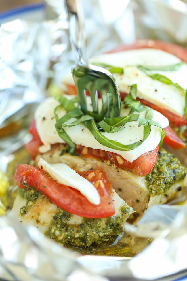 Pesto Caprese Chicken in Foil - Dinner has never been easier with these foil packets - simple wrap and bake. SO EASY! And the leftovers taste even better!