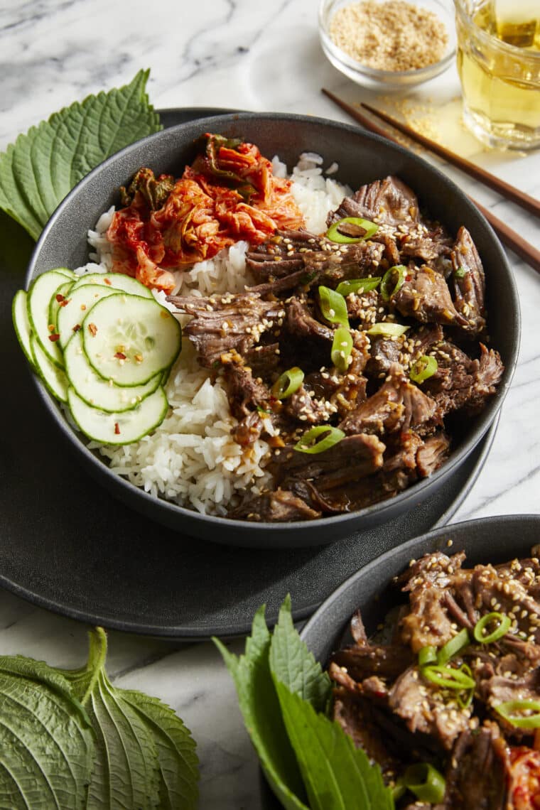 Slow Cooker Asian Short Ribs - Literally fall-off-the-bone tender! SO SO GOOD. Set and forget right in your crockpot. So easy with zero fuss!