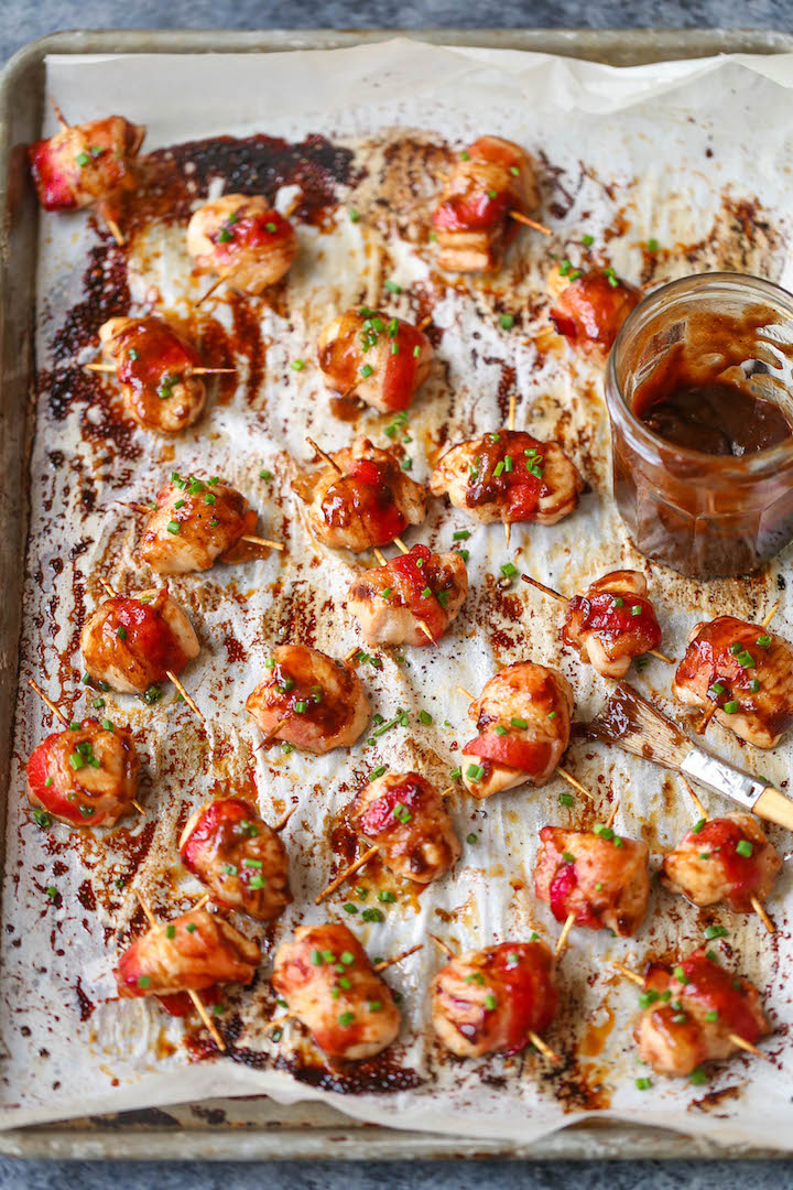 BBQ Chicken Bites - The best crowd-pleasing chicken bites wrapped in crisp-tender bacon and smothered in a smoky-sweet BBQ sauce!