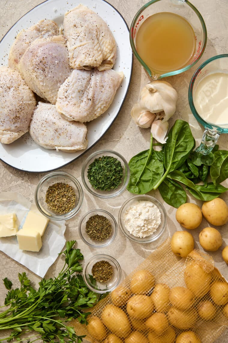 Chicken and Potatoes with Garlic Parmesan Cream Sauce - A complete meal in one! Baked crisp-tender chicken with potatoes and spinach, so good!