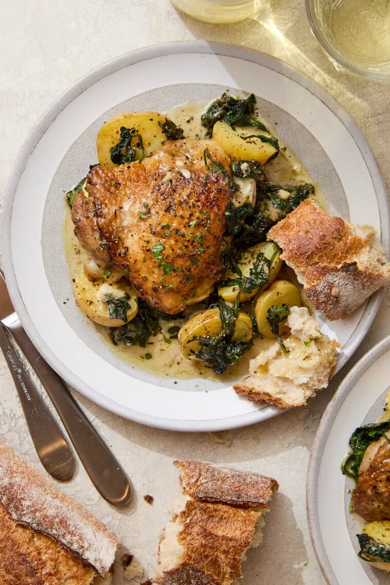 Chicken and Potatoes with Garlic Parmesan Cream Sauce - A complete meal in one! Baked crisp-tender chicken with potatoes and spinach, so good!