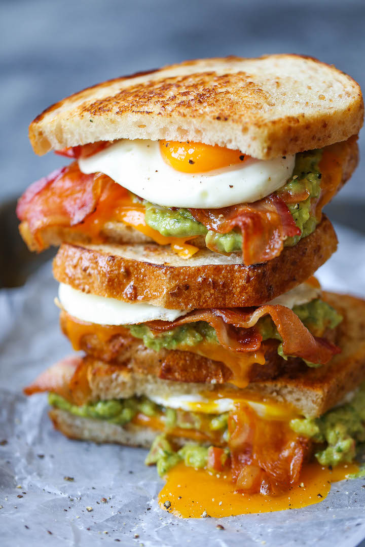 Guacamole Breakfast Sandwich - This is the absolute must-have breakfast sandwich. Crispy, buttery bread with eggs, bacon, guacamole and melted cheese!! 