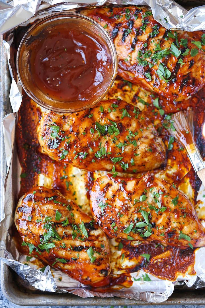 BBQ Chicken Breasts - The most tender, juicy chicken grilled to PERFECTION, smothered in a thick, homemade BBQ sauce. You can also make this ahead of time!