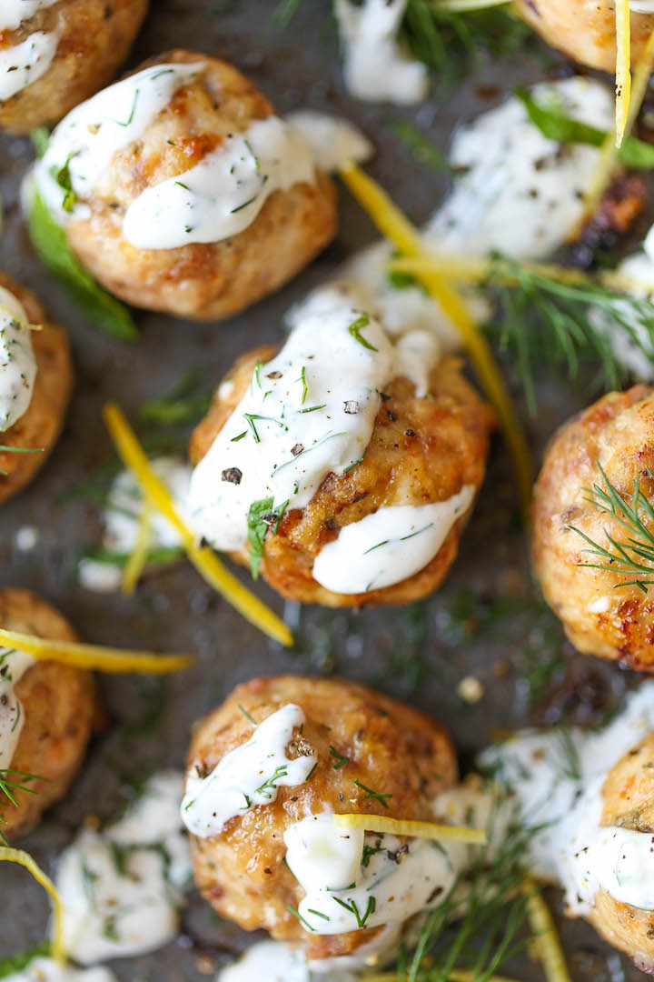 Greek Turkey Meatballs - Everyone's favorite meatballs made healthier! So moist, so tender and so easy to make, drizzled with Greek yogurt tzatziki sauce!