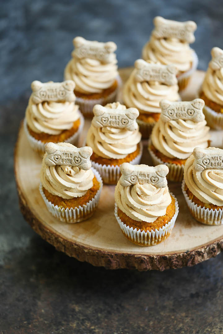 Peanut Butter Pupcakes - Treat your pup with these dog-friendly cupcakes filled with pumpkin, applesauce and carrots topped with a peanut butter frosting!