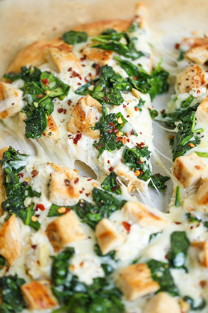 Roasted Garlic, Chicken and Spinach White Pizza - So amazingly cheesy with just the right amount of garlic. You can save the leftover garlic for later use!