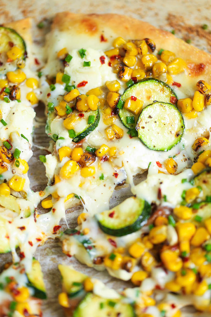 White Zucchini Corn Pizza - Use up all your lingering zucchini in the most amazing white pizza! With corn kernels, dollops of ricotta and mozzarella cheese!
