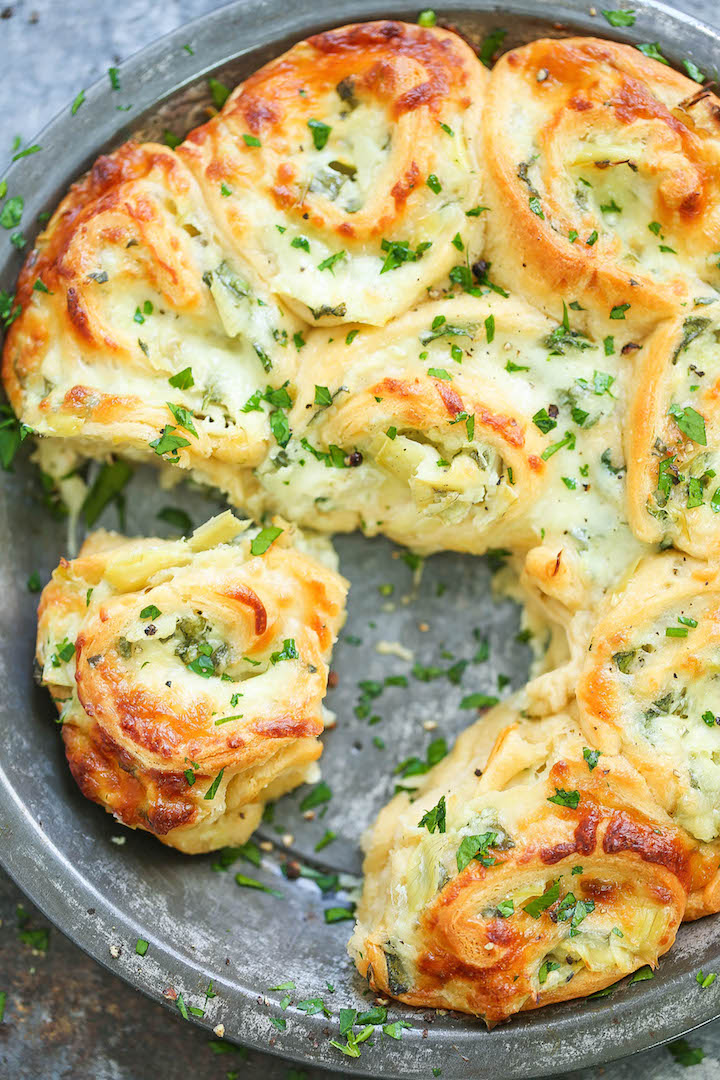 Cheesy Spinach and Artichoke Pinwheels - Everyone's favorite spinach and artichoke dip in these cheesy, creamy BAKED roll ups!!! So good for GAME DAY!!!