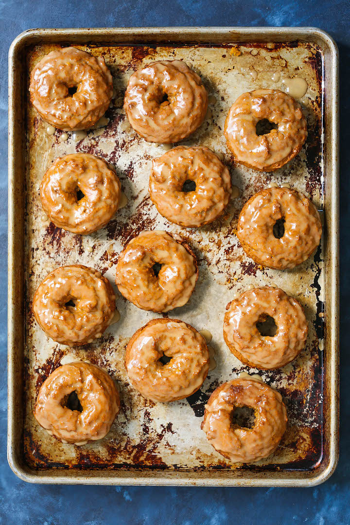 Baked Pumpkin Donuts with Maple Glaze - These are the best Fall pumpkin donuts ever. So soft, so crumbly and so perfectly smothered in a warm maple glaze!