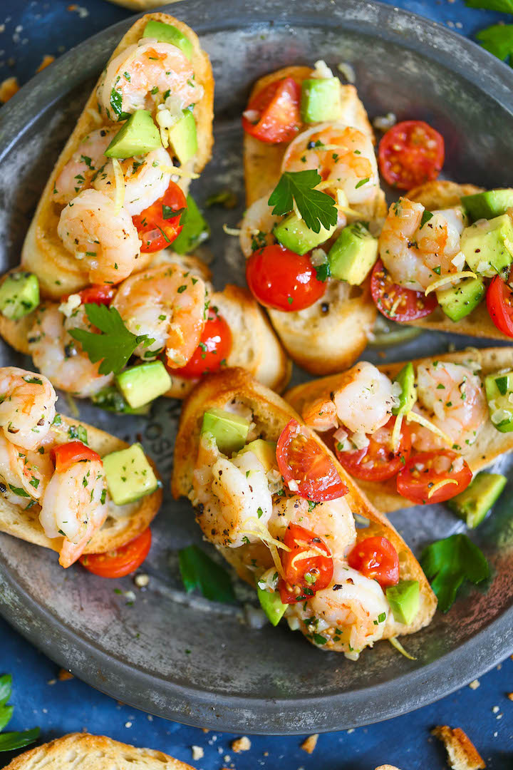 Garlic Shrimp and Avocado Crostini - The quickest and easiest appetizer you can whip up that is sure to be a crowd-pleaser! Everyone will beg for seconds!